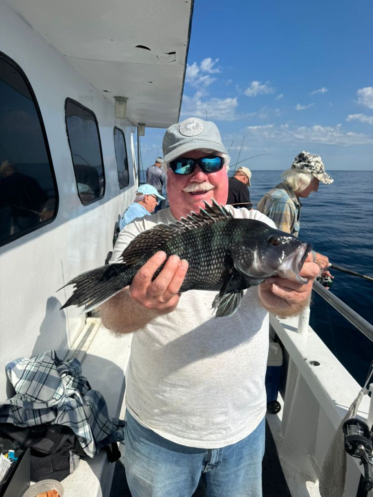 a person holding a fish