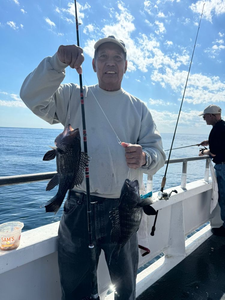 a person holding a fish in the water