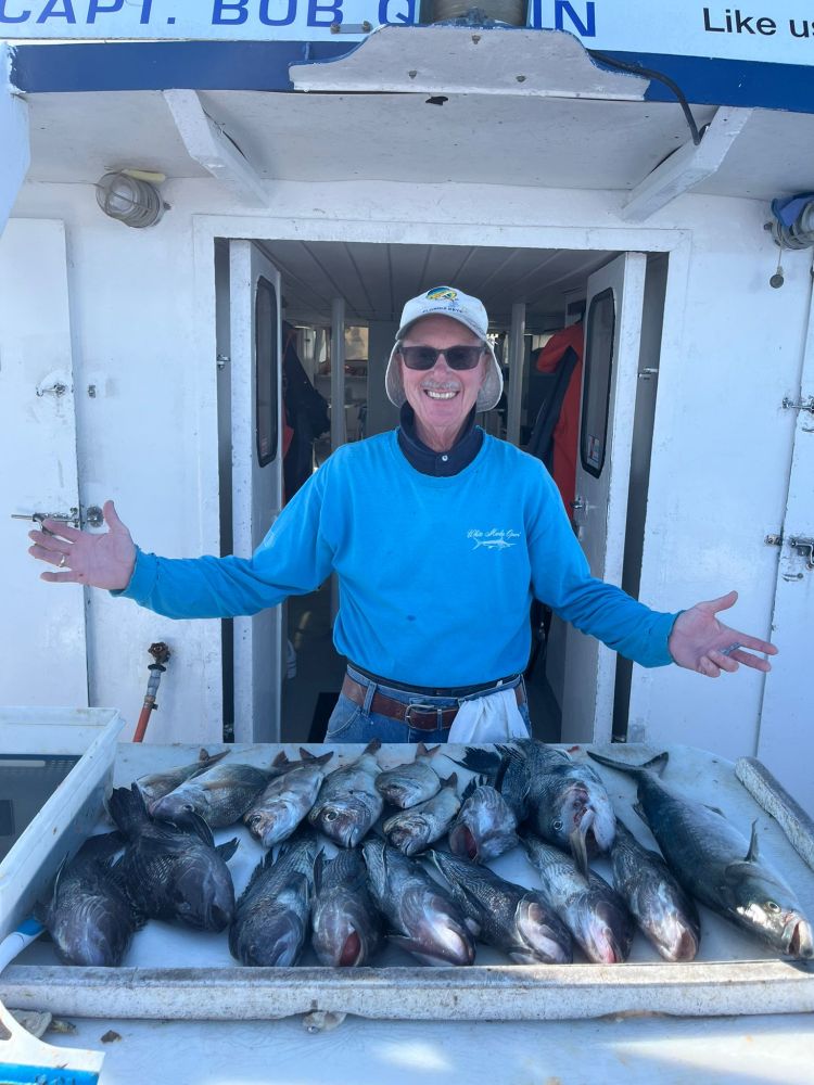 a man holding a fish