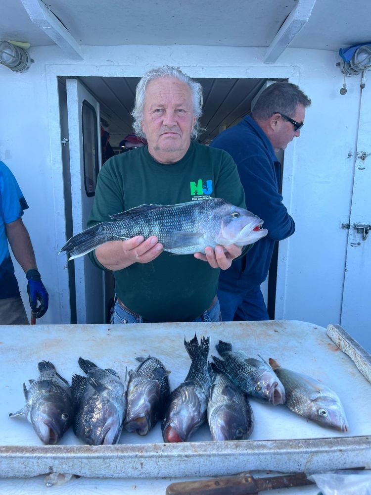 a man holding a fish