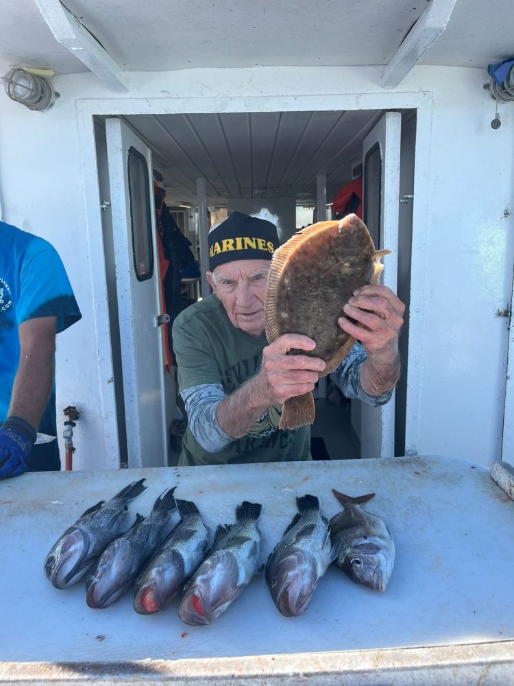 a person holding a fish