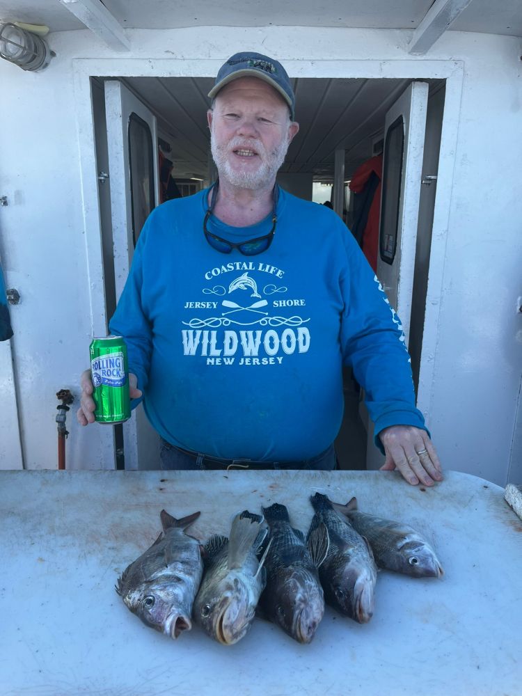 a man holding a fish