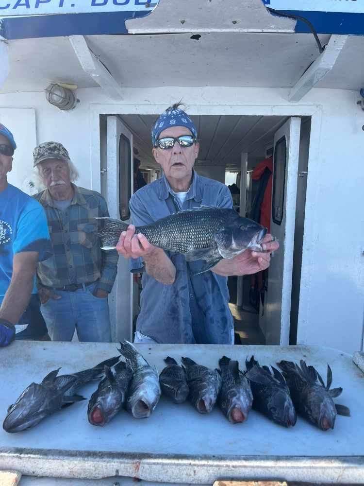 a man holding a fish