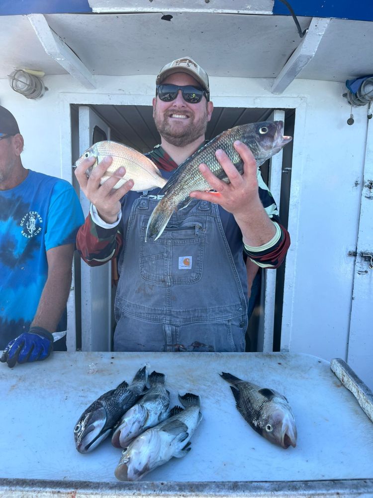 a man holding a fish